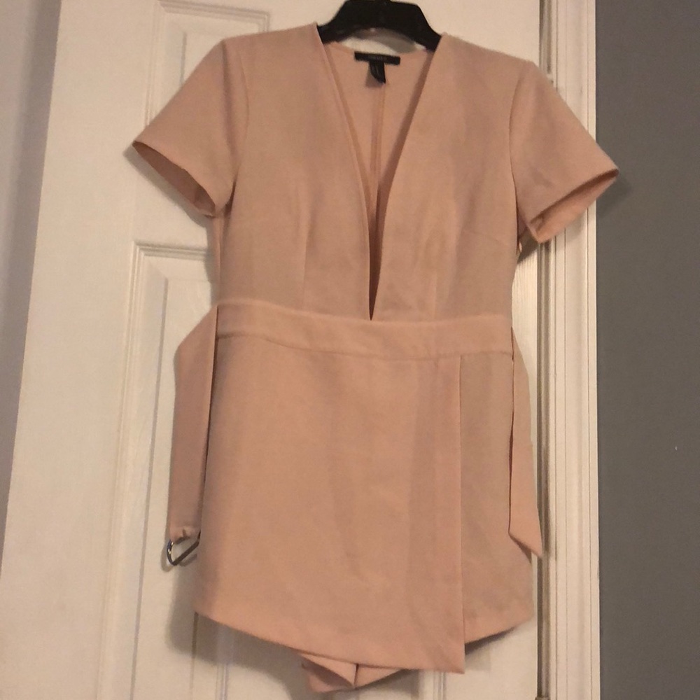 Blush romper worn once in photo